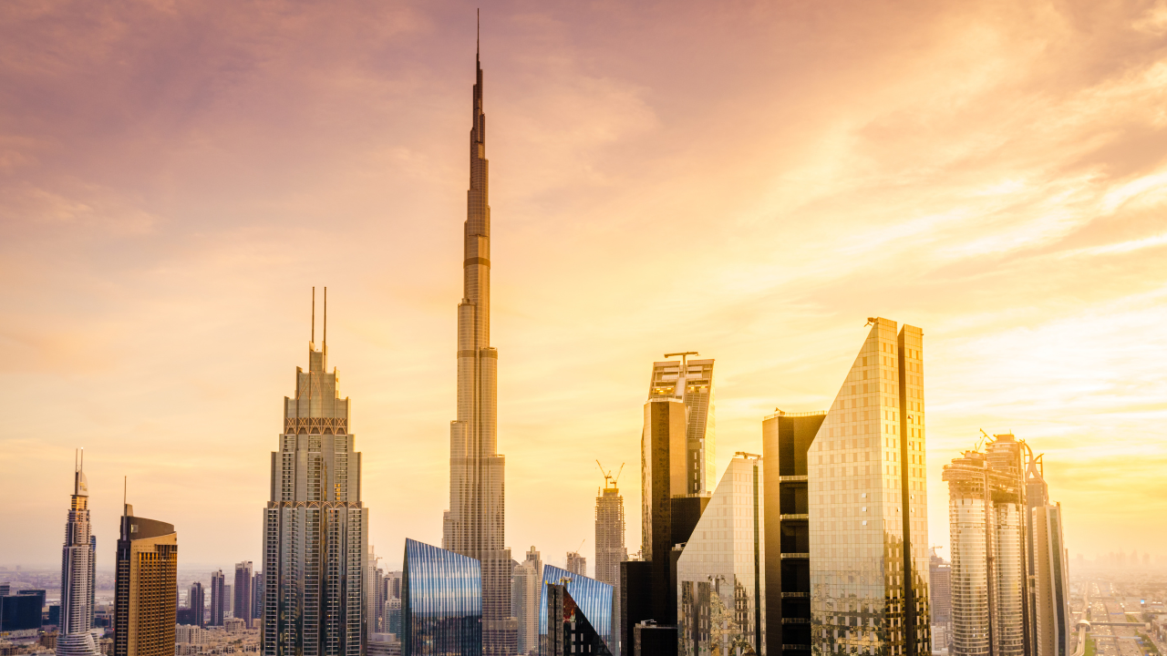 Aerial view of Dubai's skyline showcasing luxury skyscrapers and bustling city life, illustrating how Dubai's economy thrives amid Middle East conflict.