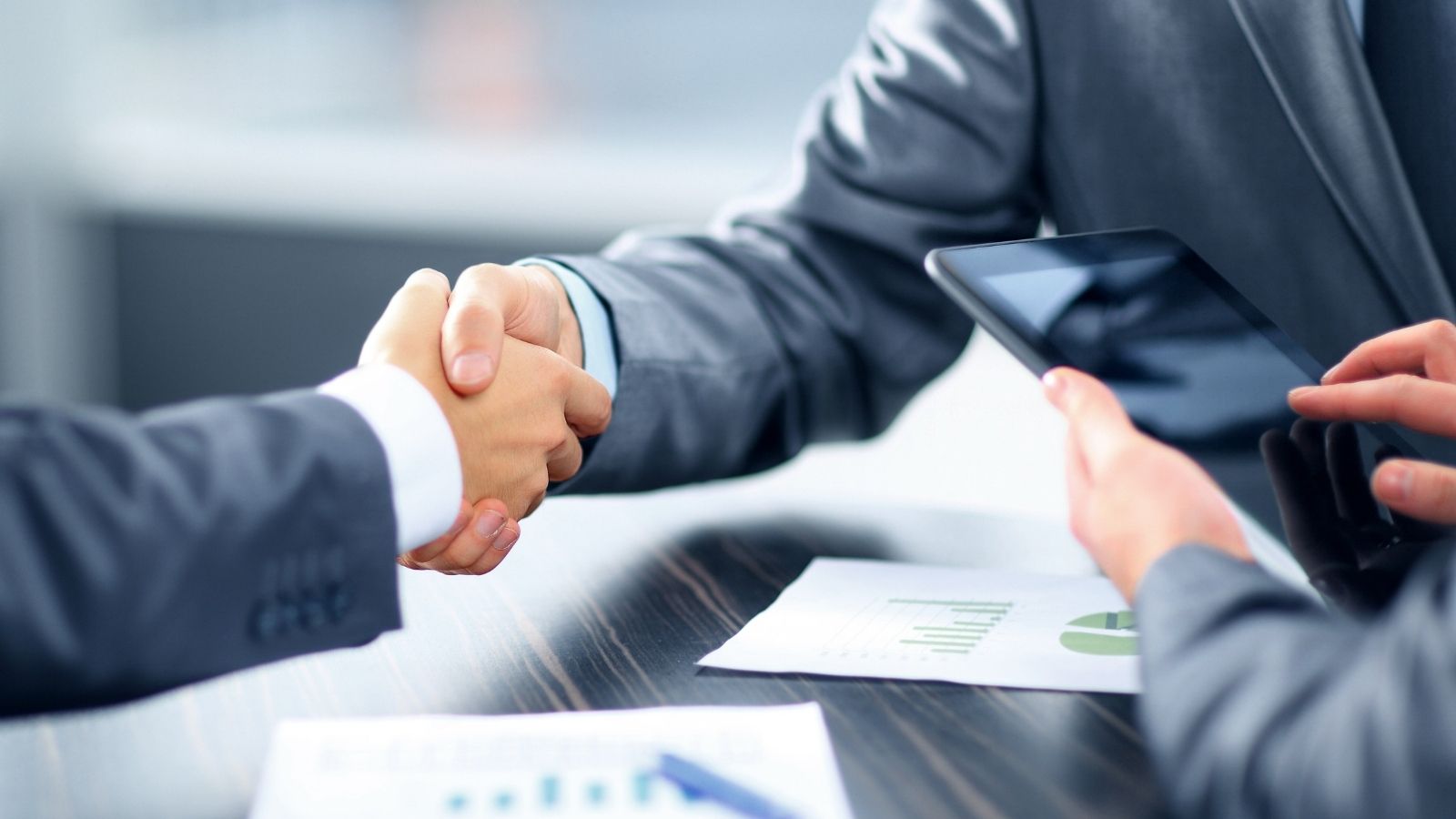 Expat investor reviewing an international financial plan with confidence